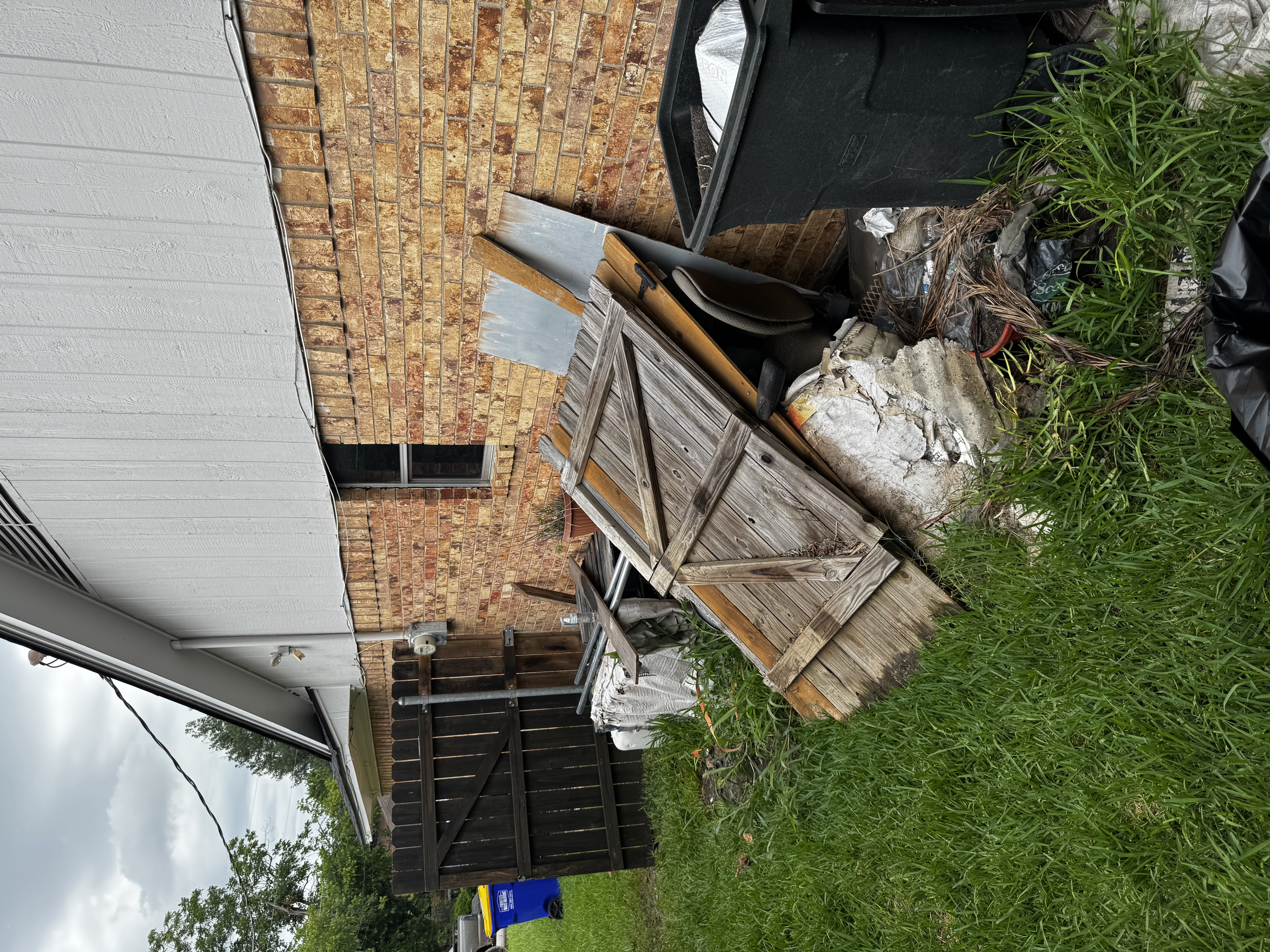 Property before cleanout — piles of junk and debris